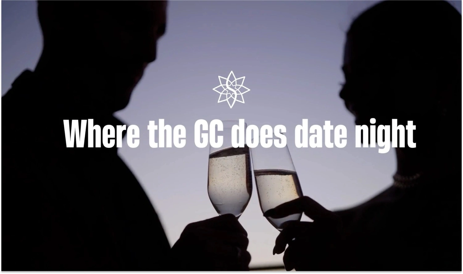 Couple toasting with champagne glasses against a sunset backdrop, highlighting a romantic date night experience.