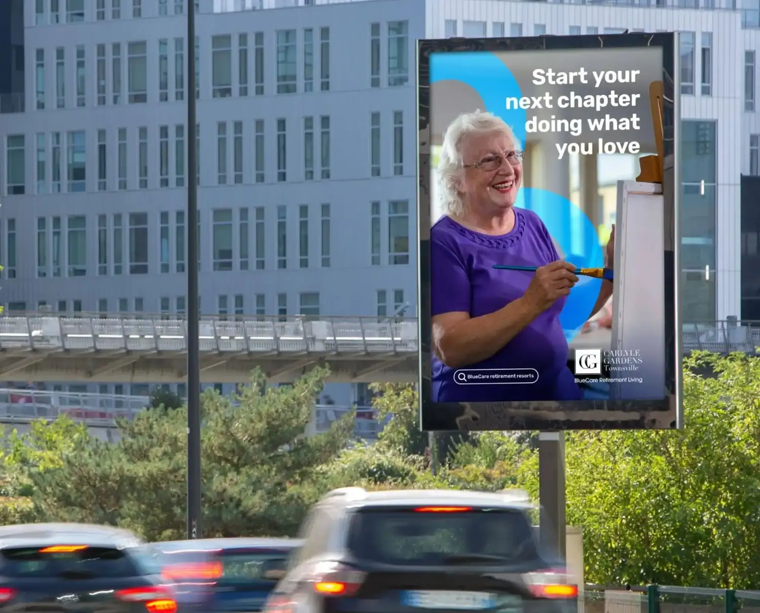 Billboard showcasing an older woman painting, promoting pursuing passions in the next chapter of life.