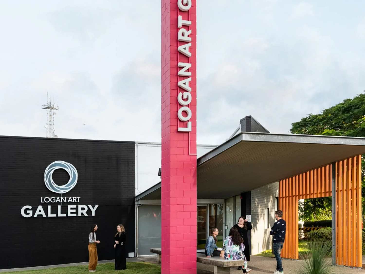 Logan Art Gallery entrance showcasing modern architecture and visitors engaging with the space.